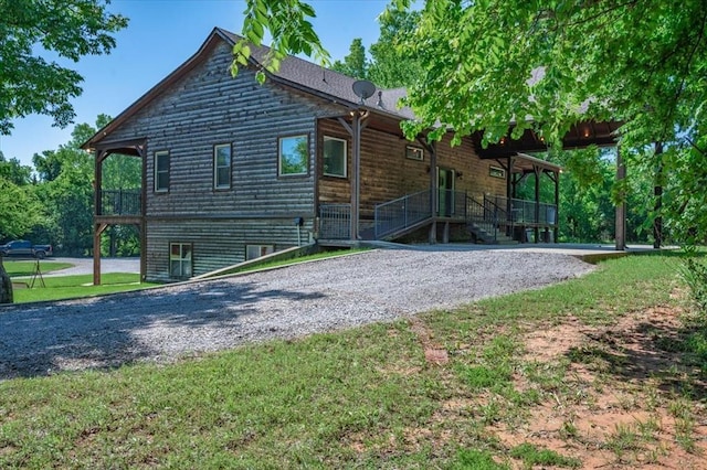 2801 John Deere Ave Unit 1, Edmond, OK 73034 - view of home's exterior with covered porch and a yard