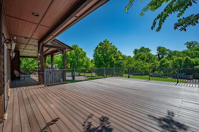 2801 John Deere Ave Unit 1, Edmond, OK 73034 - deck featuring view of wooded area