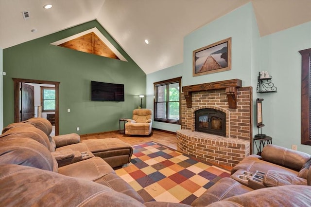 2801 John Deere Ave Unit 1, Edmond, OK 73034 - living area featuring plenty of natural light, a fireplace, wood finished floors, baseboards, and recessed lighting