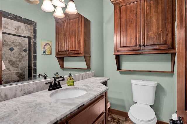 2801 John Deere Ave Unit 1, Edmond, OK 73034 - bathroom with vanity, a tile shower, toilet, baseboards, and a chandelier