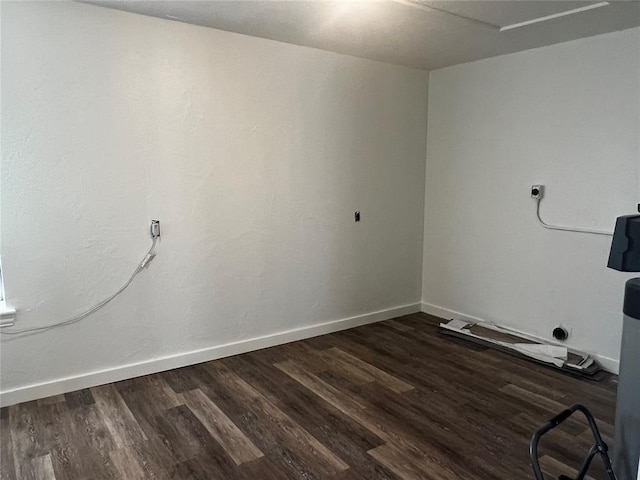 1808 Doris Ave, Tuttle, OK 73089 - laundry room with dark wood-style floors and baseboards