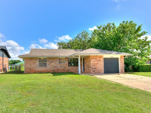 808 Robin Hill Rd, Edmond, OK 73003 - ranch-style house featuring a garage, concrete driveway, brick siding, and central AC
