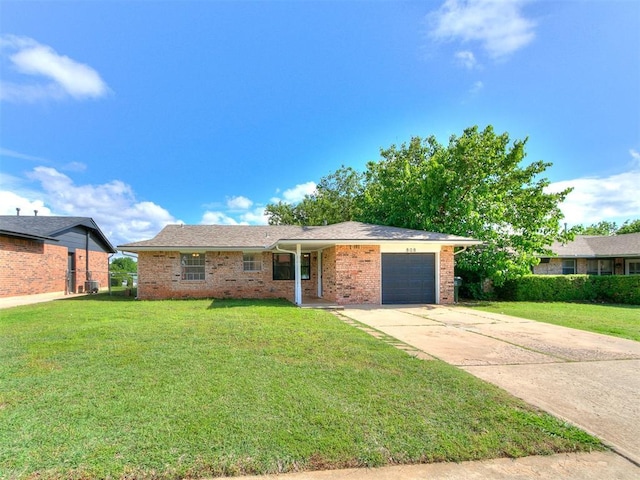808 Robin Hill Rd, Edmond, OK 73003 - single story home featuring an attached garage, driveway, a front lawn, brick siding, and cooling unit