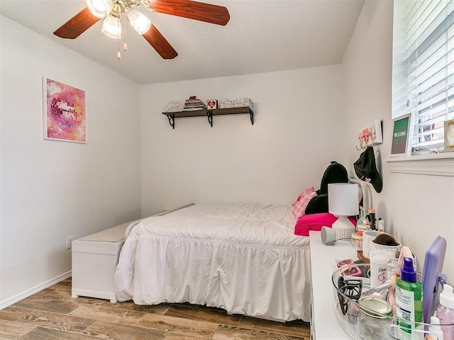 808 Robin Hill Rd, Edmond, OK 73003 - bedroom with wood finished floors and a ceiling fan