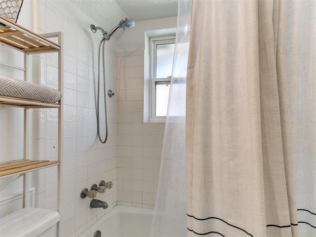 808 Robin Hill Rd, Edmond, OK 73003 - bathroom featuring shower / bath combo with shower curtain, toilet, and a textured ceiling