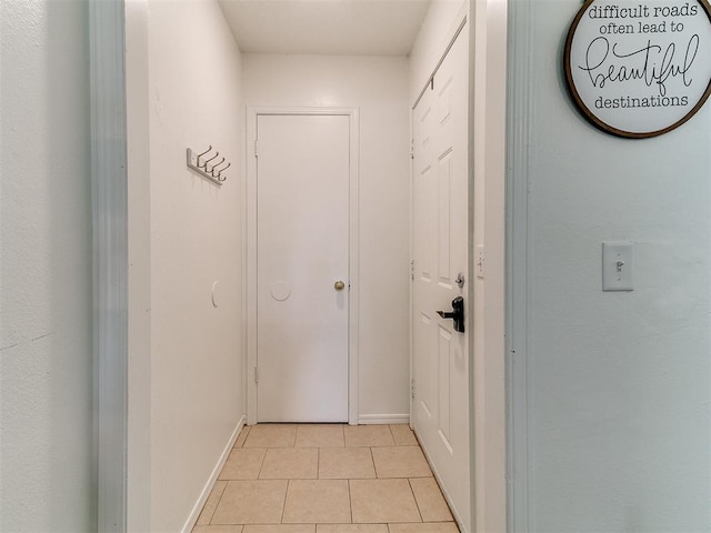 808 Robin Hill Rd, Edmond, OK 73003 - corridor with light tile patterned flooring and baseboards