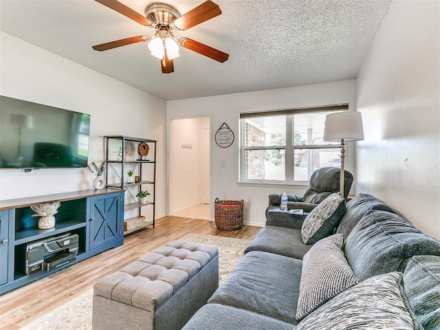 808 Robin Hill Rd, Edmond, OK 73003 - living room featuring ceiling fan, light wood finished floors, and a textured ceiling