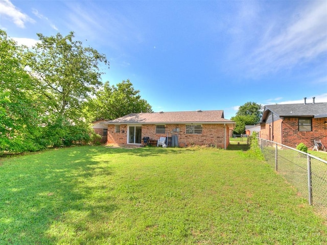 808 Robin Hill Rd, Edmond, OK 73003 - rear view of property with brick siding