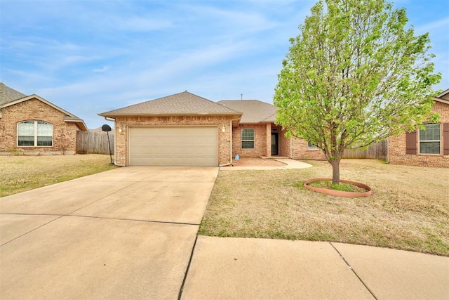 11240 NW 106th St, Yukon, OK 73099 - view of front of property with a garage, concrete driveway, a shingled roof, and brick siding