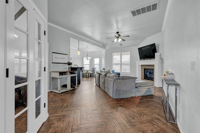 11240 NW 106th St, Yukon, OK 73099 - living area featuring ceiling fan, a glass covered fireplace, ornamental molding, and baseboards