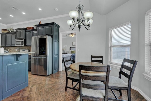 11240 NW 106th St, Yukon, OK 73099 - dining room with a chandelier, plenty of natural light, ornamental molding, a ceiling fan, and recessed lighting