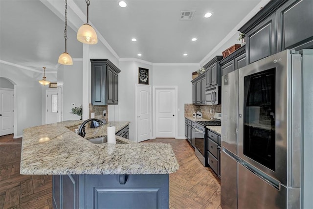 11240 NW 106th St, Yukon, OK 73099 - kitchen with appliances with stainless steel finishes, a sink, tasteful backsplash, crown molding, and light stone countertops