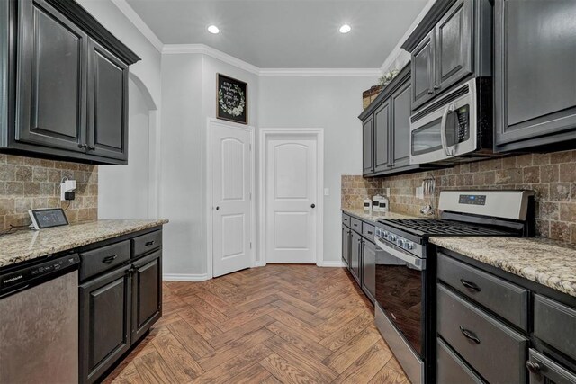 11240 NW 106th St, Yukon, OK 73099 - kitchen featuring appliances with stainless steel finishes, crown molding, baseboards, recessed lighting, and decorative backsplash