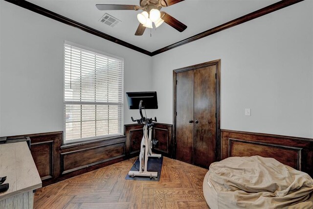 11240 NW 106th St, Yukon, OK 73099 - exercise area with a wainscoted wall, ceiling fan, ornamental molding, and plenty of natural light