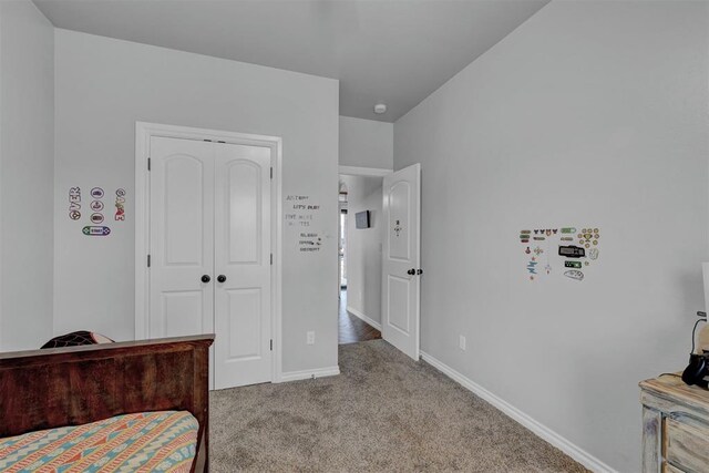 11240 NW 106th St, Yukon, OK 73099 - carpeted bedroom with a closet and baseboards