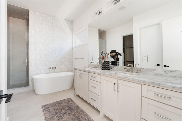 907 NW 44th St, Oklahoma City, OK 73118 - bathroom with double vanity, a soaking tub, and a shower stall