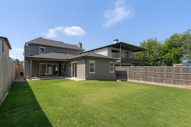 907 NW 44th St, Oklahoma City, OK 73118 - rear view of house featuring stucco siding and a patio