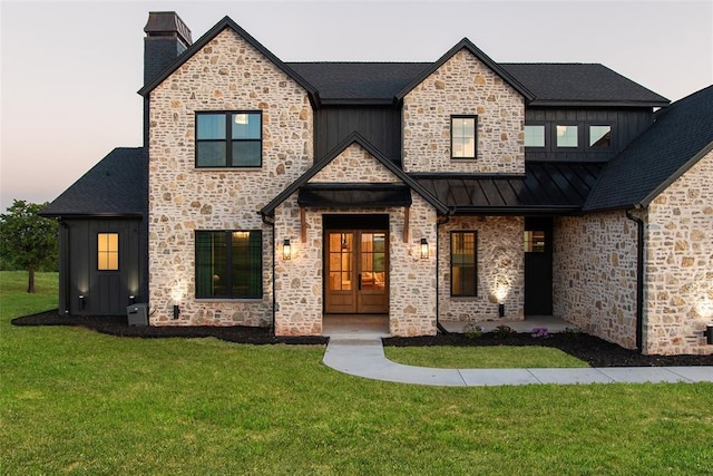 16000 N Hogback Rd, Luther, OK 73054 - view of front of home featuring french doors, stone siding, and a chimney