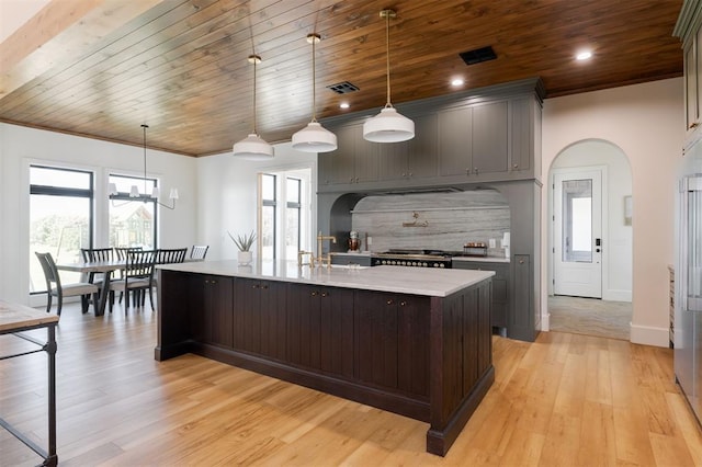 16000 N Hogback Rd, Luther, OK 73054 - kitchen featuring light countertops, wood ceiling, range, light wood-style flooring, and a spacious island