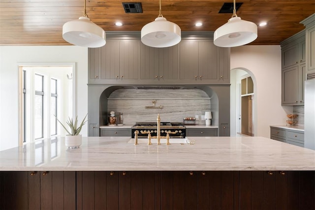 16000 N Hogback Rd, Luther, OK 73054 - kitchen featuring wood ceiling, gray cabinetry, a large island, arched walkways, and recessed lighting