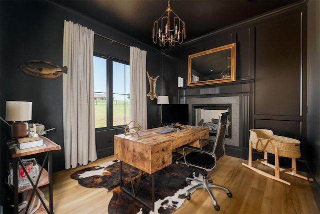 16000 N Hogback Rd, Luther, OK 73054 - office space with a chandelier, light wood-style flooring, ornamental molding, and a fireplace