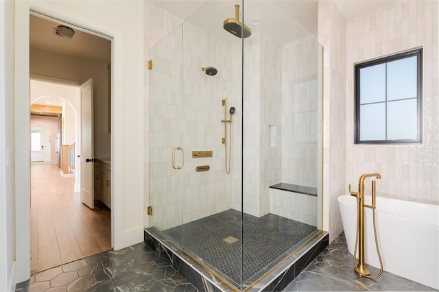 16000 N Hogback Rd, Luther, OK 73054 - full bathroom with a shower stall and a soaking tub
