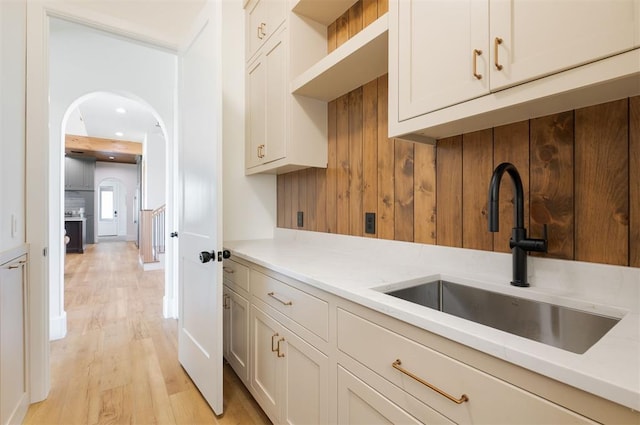 16000 N Hogback Rd, Luther, OK 73054 - kitchen with a sink, light wood-style floors, arched walkways, light countertops, and recessed lighting