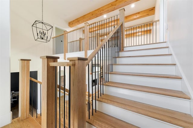 16000 N Hogback Rd, Luther, OK 73054 - staircase with a chandelier, beamed ceiling, wood finished floors, and recessed lighting