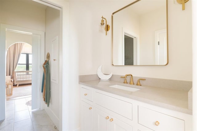 16000 N Hogback Rd, Luther, OK 73054 - bathroom with vanity, baseboards, and marble look tile flooring