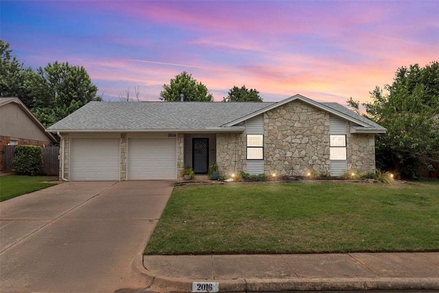 2016 Castle Rock, Edmond, OK 73003 - view of front facade with stone siding, driveway, a garage, and roof with shingles