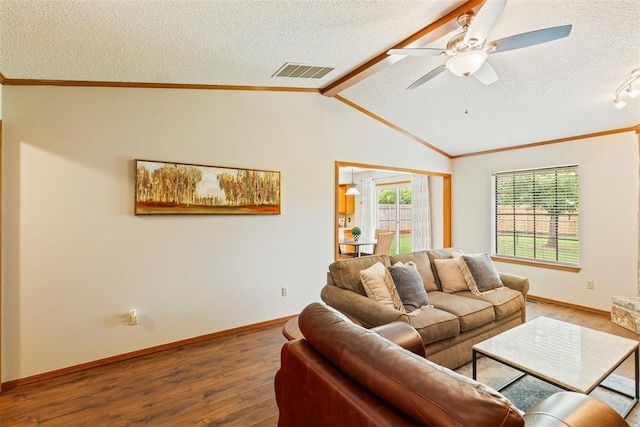 2016 Castle Rock, Edmond, OK 73003 - living room featuring a textured ceiling, wood finished floors, ceiling fan, ornamental molding, and baseboards