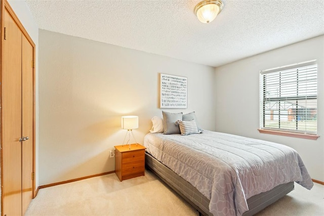 2016 Castle Rock, Edmond, OK 73003 - bedroom featuring light colored carpet, baseboards, and a textured ceiling
