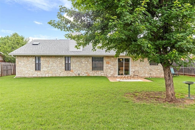 2016 Castle Rock, Edmond, OK 73003 - rear view of house with stone siding, roof with shingles, and a patio area