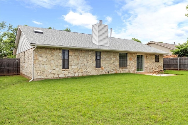2016 Castle Rock, Edmond, OK 73003 - back of house with stone siding, a chimney, a shingled roof, and a patio
