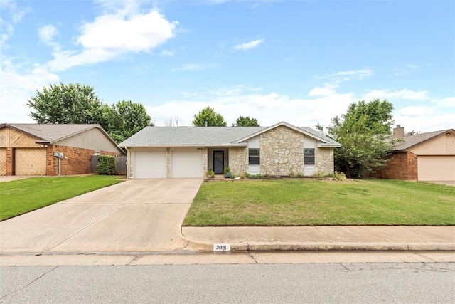 2016 Castle Rock, Edmond, OK 73003 - view of front facade with stone siding, an attached garage, a front lawn, and driveway