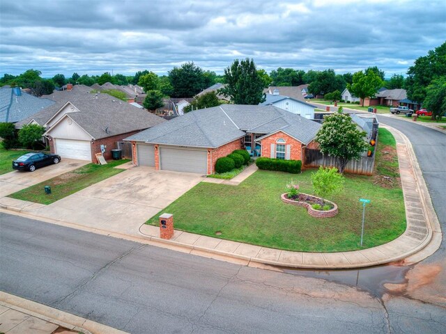 1813 Richard Dr, Edmond, OK 73003 - view of front of home with an attached garage, driveway, brick siding, and a residential view