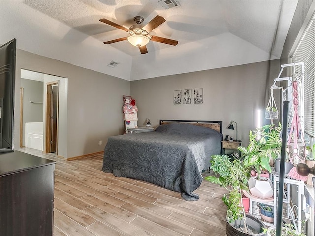 1813 Richard Dr, Edmond, OK 73003 - bedroom with light wood-type flooring, vaulted ceiling, baseboards, and ceiling fan