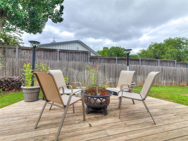 1813 Richard Dr, Edmond, OK 73003 - wooden terrace featuring an outdoor fire pit and a fenced backyard