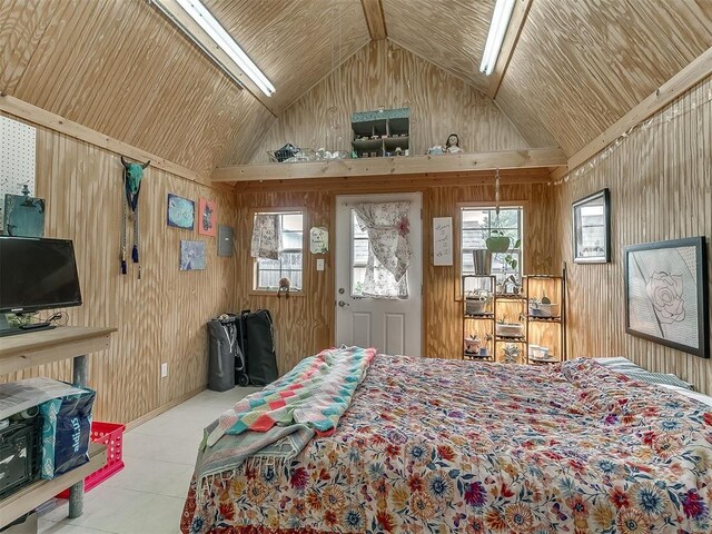 1813 Richard Dr, Edmond, OK 73003 - tiled bedroom featuring vaulted ceiling, wood walls, and multiple windows