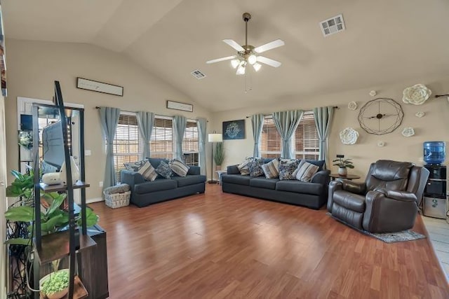 3224 Peacock Ln, Altus, OK 73521 - living room featuring a ceiling fan, plenty of natural light, wood finished floors, and high vaulted ceiling