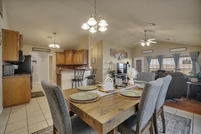 3224 Peacock Ln, Altus, OK 73521 - dining space with a chandelier, light tile patterned floors, lofted ceiling, and ceiling fan