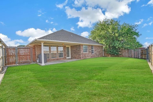3224 Peacock Ln, Altus, OK 73521 - rear view of house with brick siding, a patio, and a shingled roof