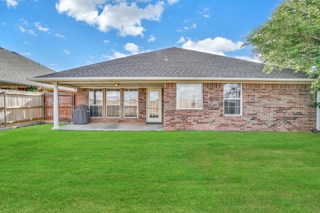 3224 Peacock Ln, Altus, OK 73521 - back of house featuring a shingled roof, brick siding, and a patio area