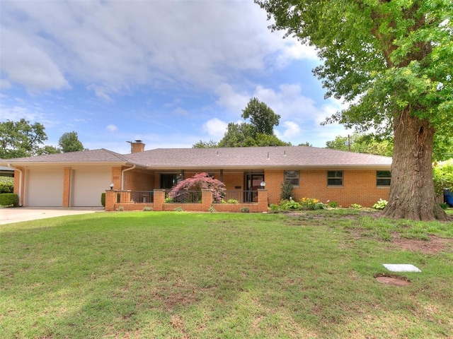 203 N Sherry Ave, Norman, OK 73069 - ranch-style home with brick siding, an attached garage, a front yard, a chimney, and driveway