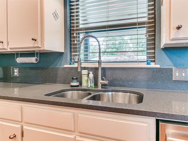 203 N Sherry Ave, Norman, OK 73069 - kitchen featuring a sink, healthy amount of natural light, white cabinetry, and tasteful backsplash