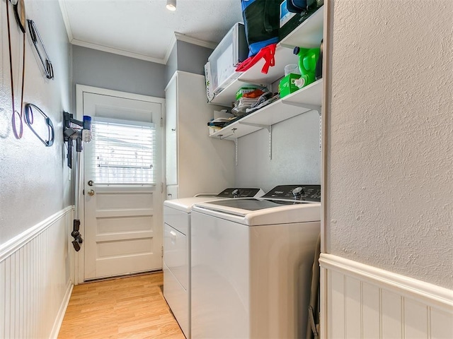 203 N Sherry Ave, Norman, OK 73069 - laundry area featuring independent washer and dryer, ornamental molding, light wood finished floors, wainscoting, and a textured wall