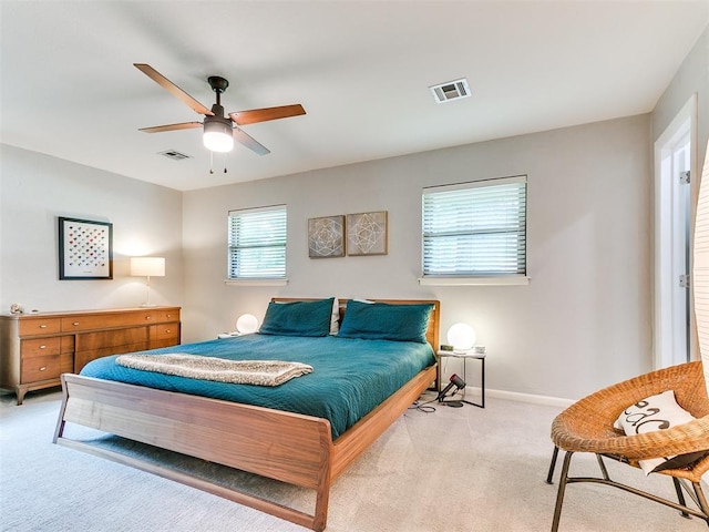 203 N Sherry Ave, Norman, OK 73069 - bedroom featuring light colored carpet, baseboards, and a ceiling fan