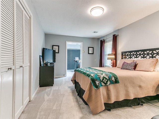 203 N Sherry Ave, Norman, OK 73069 - bedroom featuring light carpet, baseboards, and a closet