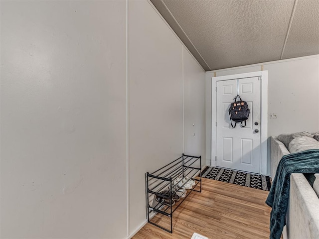 14417 Longhorn Dr, Jones, OK 73049 - foyer entrance with wood finished floors and a textured ceiling