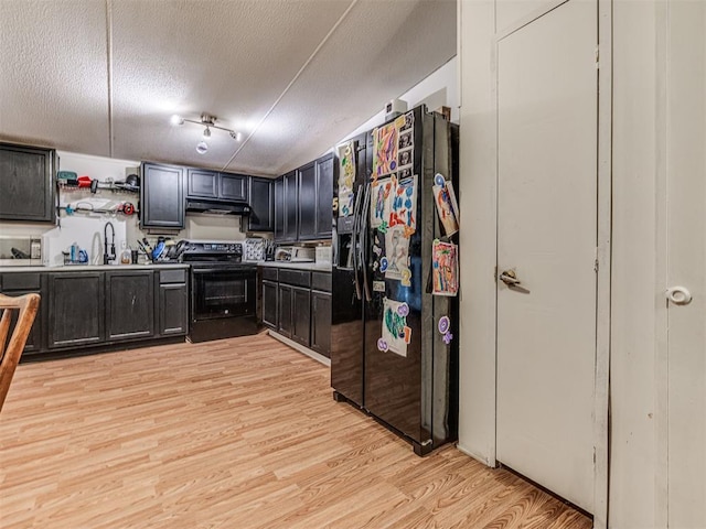 14417 Longhorn Dr, Jones, OK 73049 - kitchen with black appliances, a textured ceiling, light wood-style flooring, a sink, and open shelves